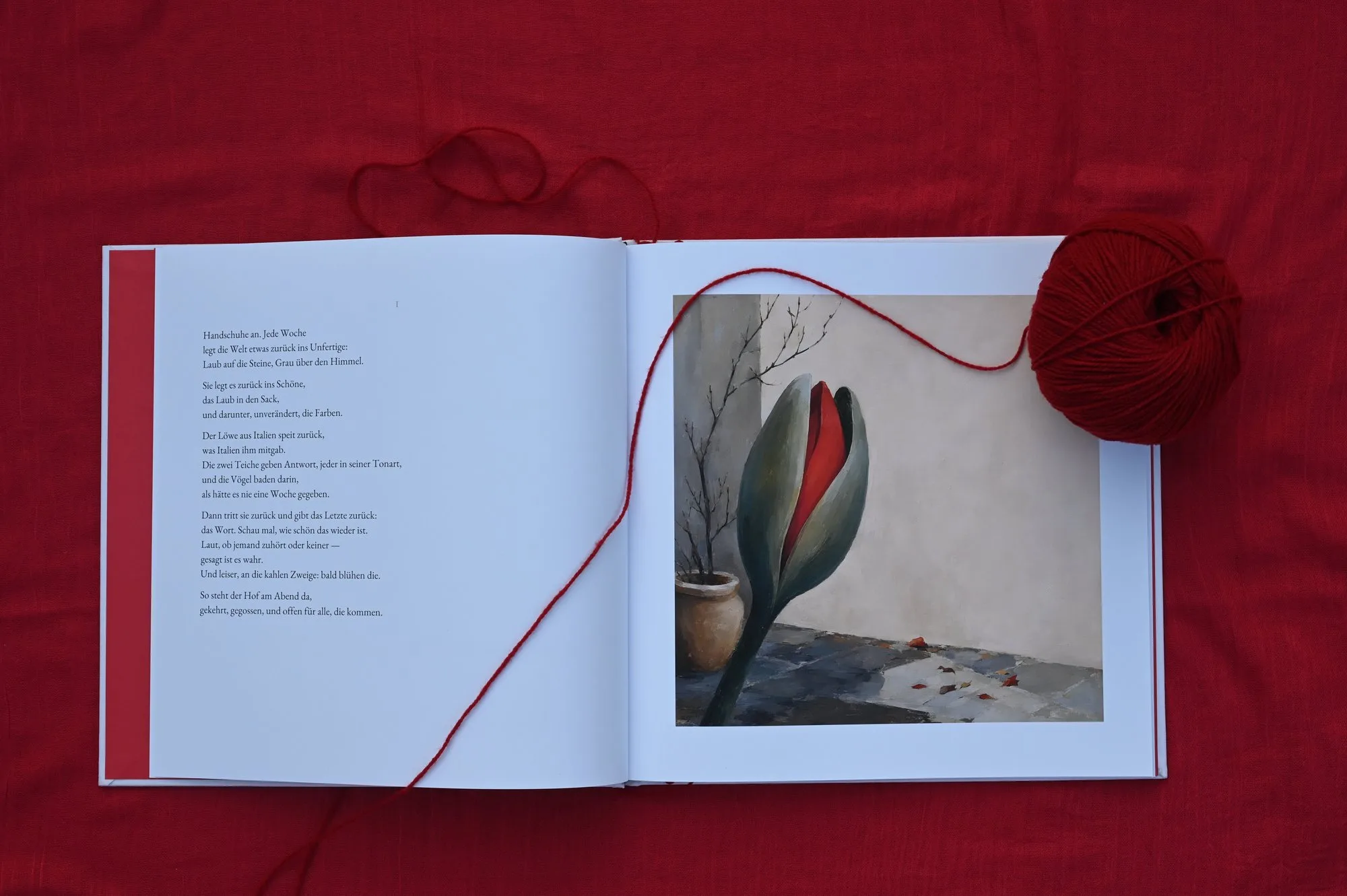 A spread — a German poem facing a painting of a tulip bud, its green sheath splitting open to red.